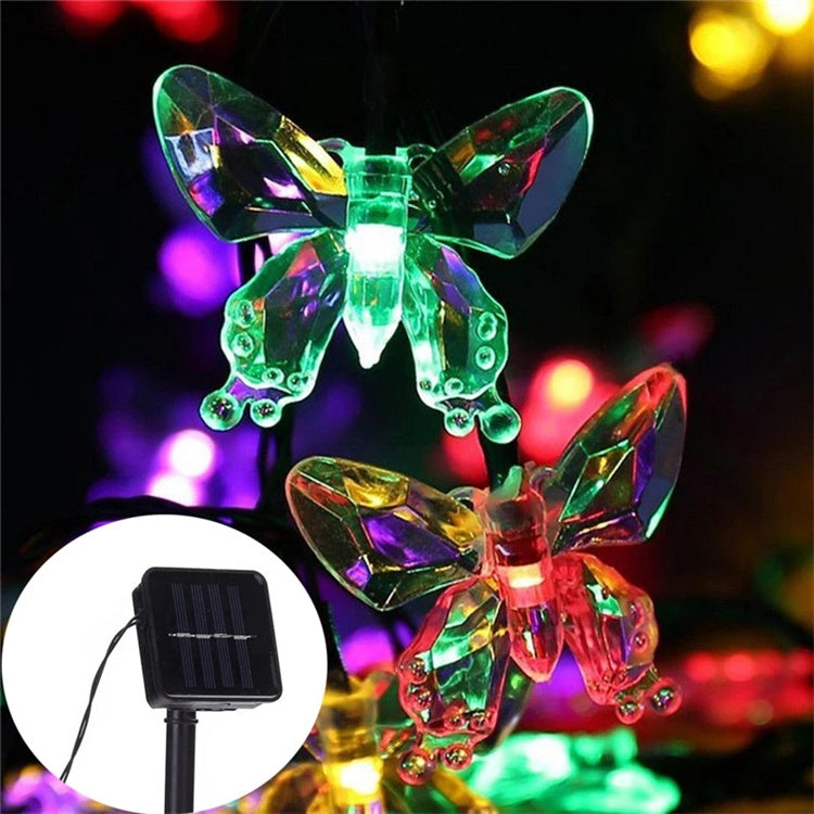 Detalle de mariposa LED y panel solar